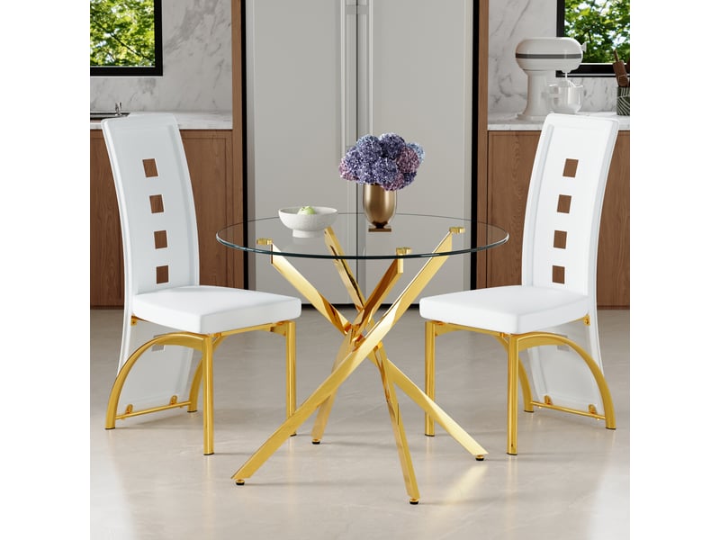  Ensemble table ronde et deux chaises, plateau en verre trempé 88 cm, sièges blancs en similicuir pu et structures métalliques dorées  - Conforama C