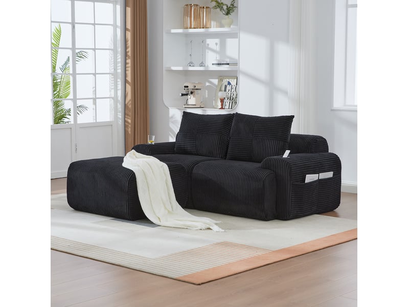  Canapé modulable 2 places en velours côtelé noir avec repose-pieds, porte-gobelet et poche latérale  - Conforama D