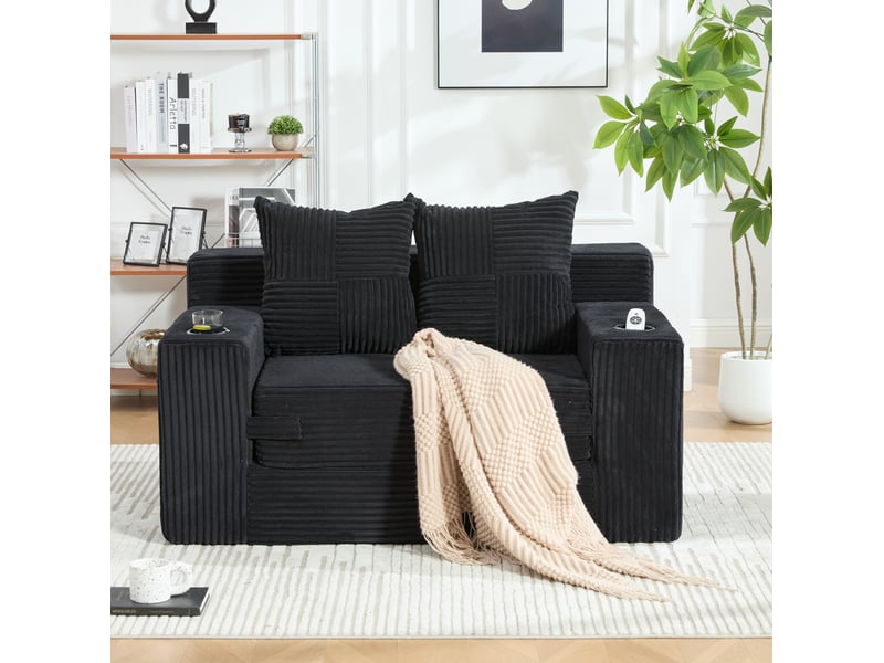  Canapé convertible 2 places modenvie en velours côtelé noir avec deux coussins, support pour gobelet et poches latérales 151 x 133 x 64 cm  - Conforama D