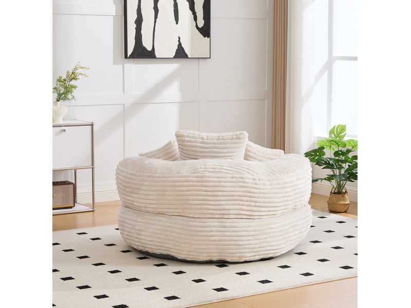  Fauteuil pouf lounge avec dossier haut, accoudoirs enveloppants et assise confortable en velours côtelé beige  - Conforama C