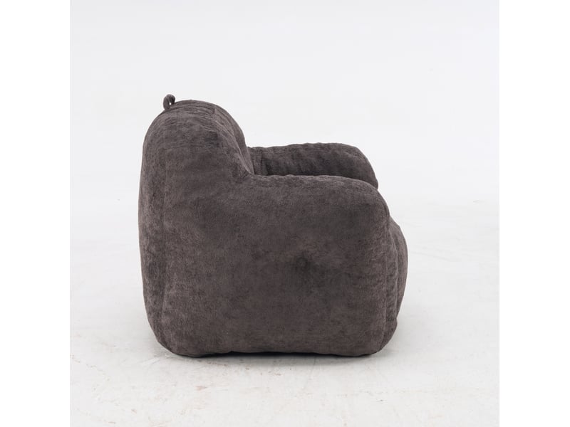 Fauteuil pouf avec accoudoirs et dossier enveloppant, rembourrage en mousse déchiquetée, en fausse fourrure gris foncé - Conforama A