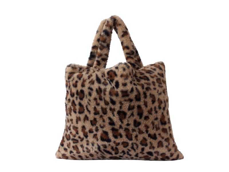  Plaid effet fourrure léopard 300 g,m² en flanelle avec sac de rangement - 125x150cm - noir  - Conforama C
