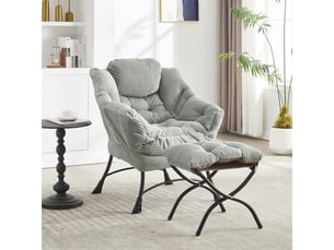 Fauteuil lounge vert clair avec repose-pieds, accoudoirs et poche latérale, petit espace