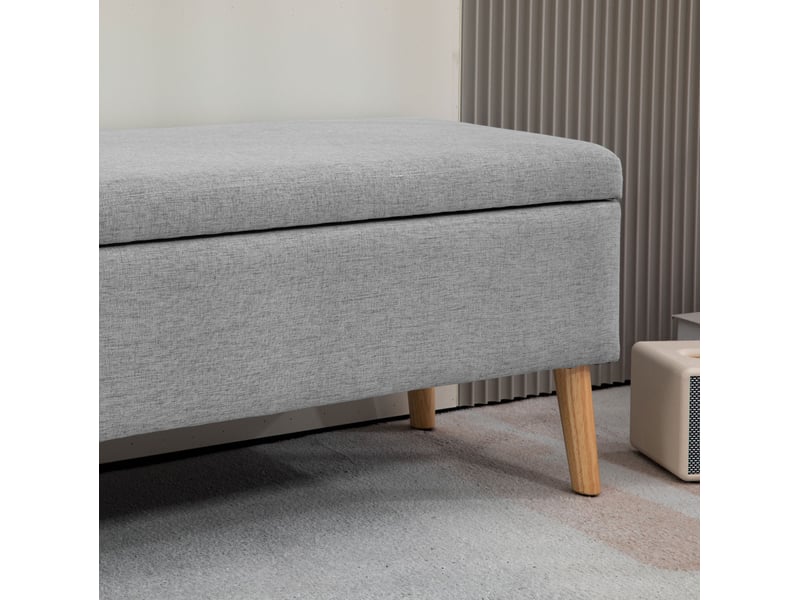  Banc de rangement 110 x 39 x 45 cm gris en polyester, assise rembourrée avec coffre et pieds en bois d'hévéa  - Conforama D