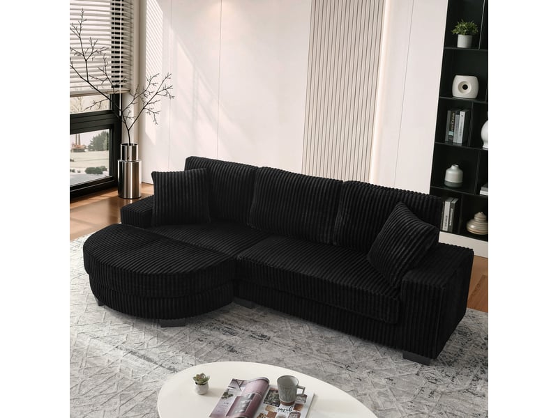 Canapé d'angle modulable réversible 4 places 256,5x133,5x89 cm, pouf ovale mobile, 2 coussins, jusqu'à 450 kg, velours côtelé noir - Conforama D