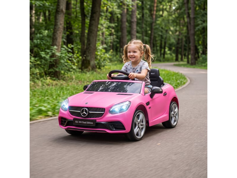  Voiture électrique pour enfants, avec phares led, ceinture de sécurité, klaxon, musique, vitesse de 3 à 5 kmh, rose, 107 x 62,5 x 44 cm  - Conforama D