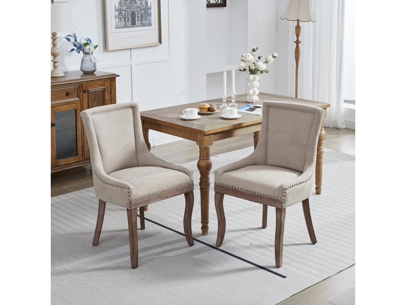 Lot de 2 chaises de salle à manger en tissu épais beige pieds en bois massif clous bronze  - Conforama B