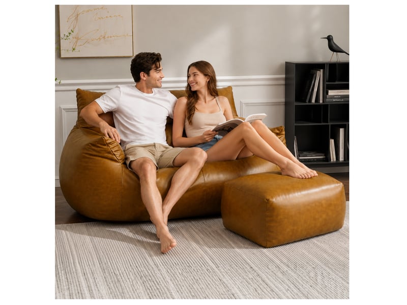  Fauteuil pouf marron avec repose-pieds, tissu technique aspect simili cuir, mousse à mémoire de forme  - Conforama B