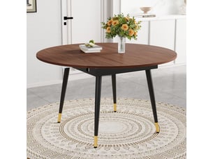 Table à manger extensible moderne se transformant de ronde à ovale en mdf noir noyer avec accents dorés sur pieds métal gain de place