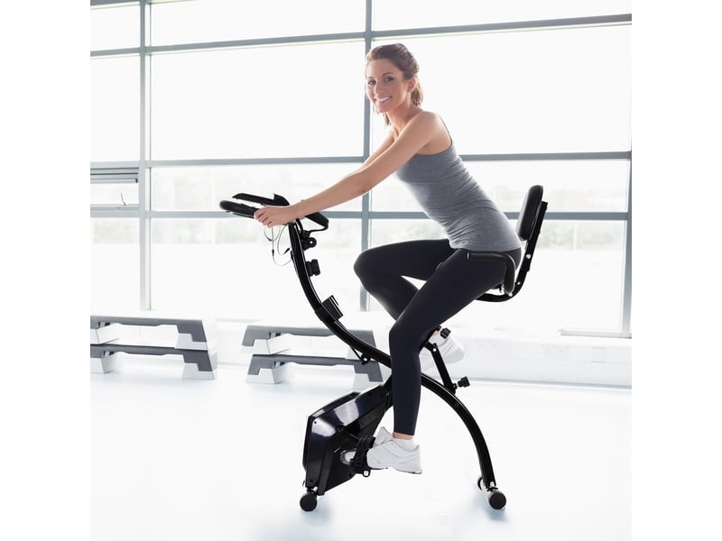  Vélo appartement pliable 4 en 1, silencieux, cordes résistance, cardio, roulettes, lcd, max 120 kg, noir.  - Conforama C