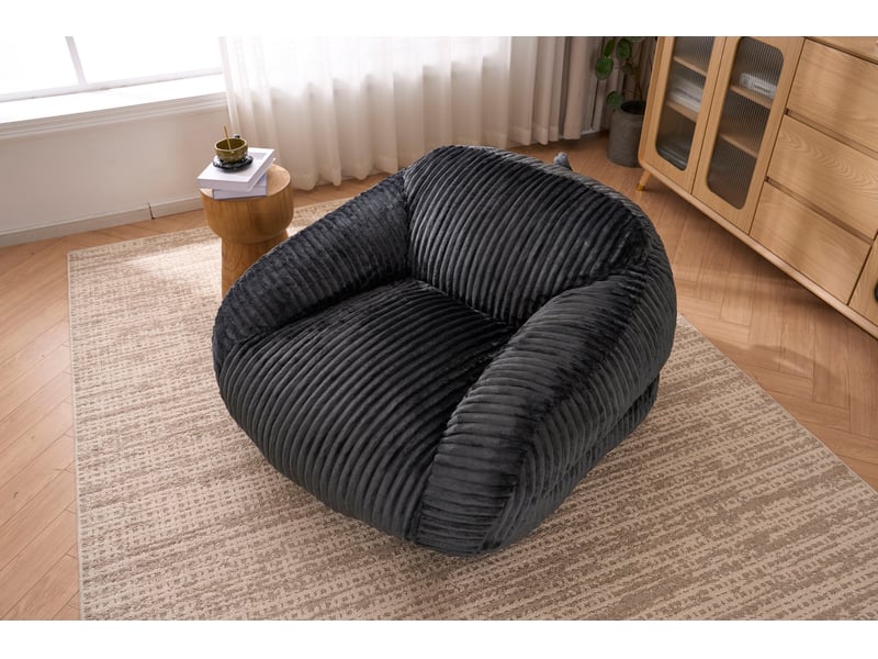  Fauteuil pouf adulte avec dossier enveloppant et assise moelleuse, sans montage, en velours côtelé gris foncé  - Conforama C