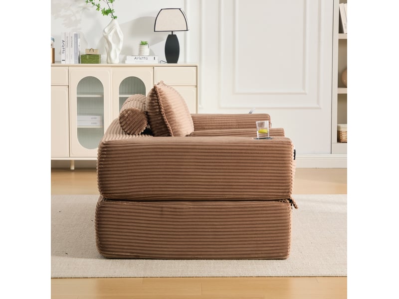  Canapé convertible 2 places avec couchage, poches latérales, porte-gobelet et coussins en velours côtelé marron  - Conforama D