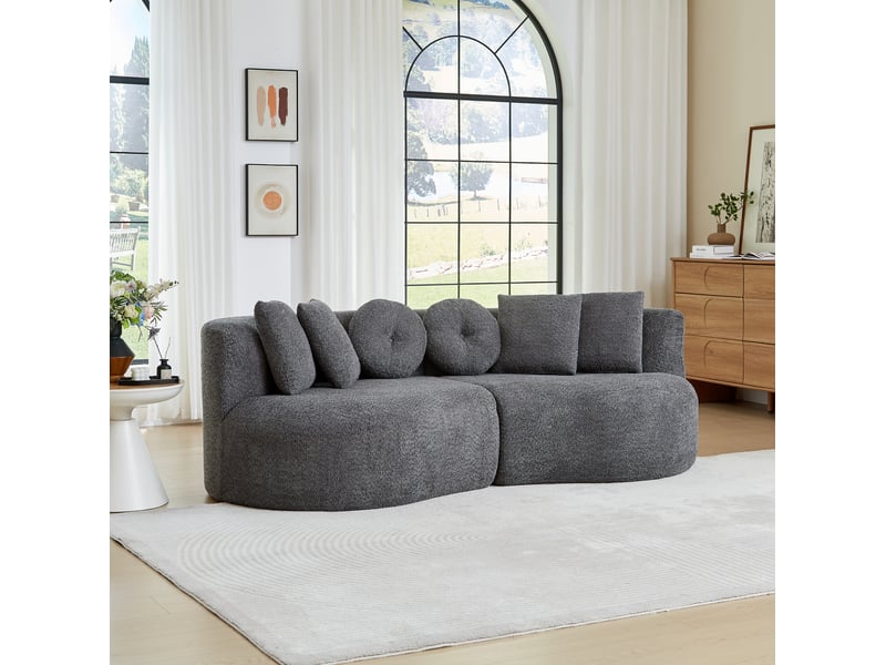  Canapé modulaire 2 pièces, en forme de noix de cajou, en chenille anthracite, sans accoudoirs, avec dossier continu et 6 coussins  - Conforama D