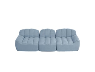 Canapé modulable 3 places bleu en tissu bouclette, sans cadre, à assise profonde, confortable pour le salon familial.