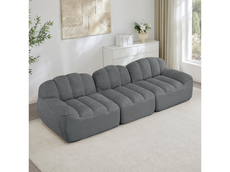  Canapé d'angle modulaire sans armature avec assise profonde et ottoman, pour salon, en flanelle granulée, gris  - Conforama C