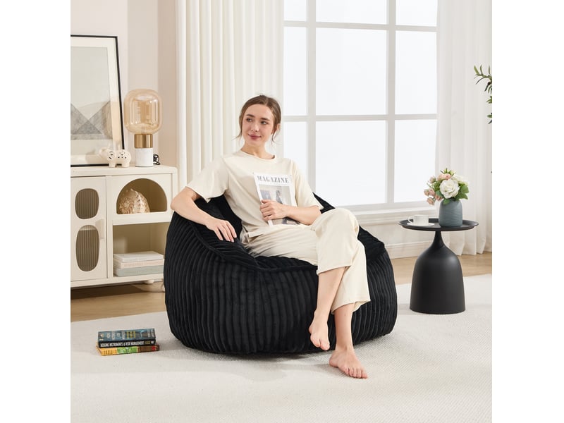  Fauteuil pouf garni de mousse à mémoire de forme avec dossier et accoudoirs en velours côtelé noir  - Conforama D