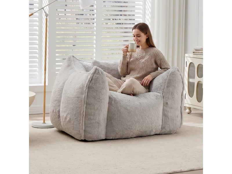 Pouf géant gris en fausse fourrure avec coussin, assise confortable pour salon - Conforama B