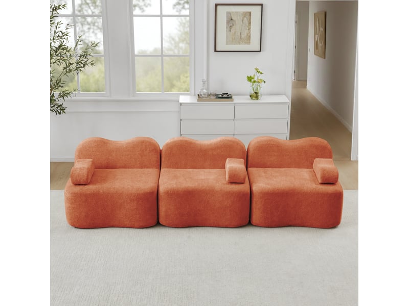  Canapé modulaire 3 places en velours orange, forme ondulée et assise profonde pour un salon accueillant  - Conforama E