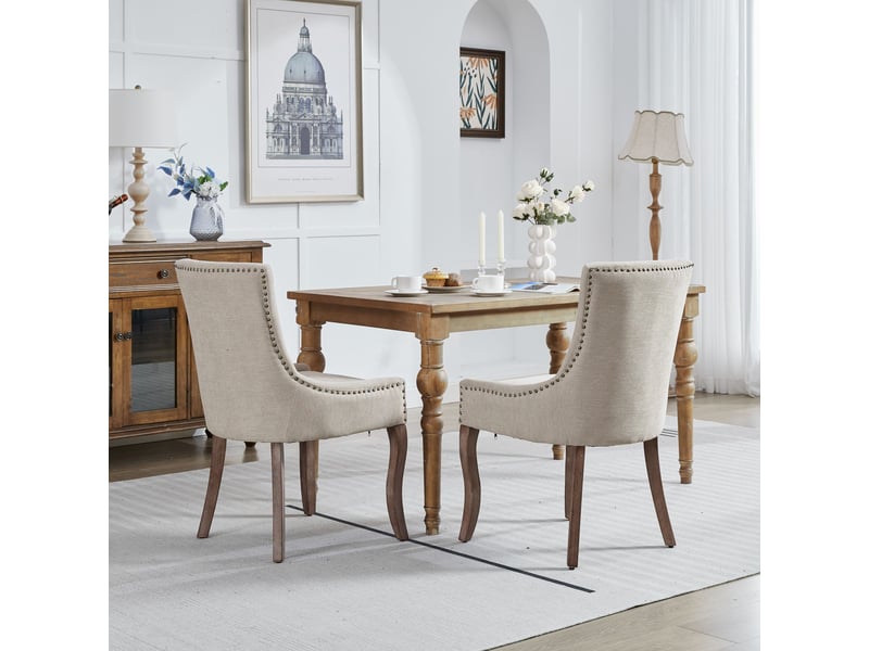 Lot de 2 chaises de salle à manger en tissu épais beige pieds en bois massif clous bronze  - Conforama C