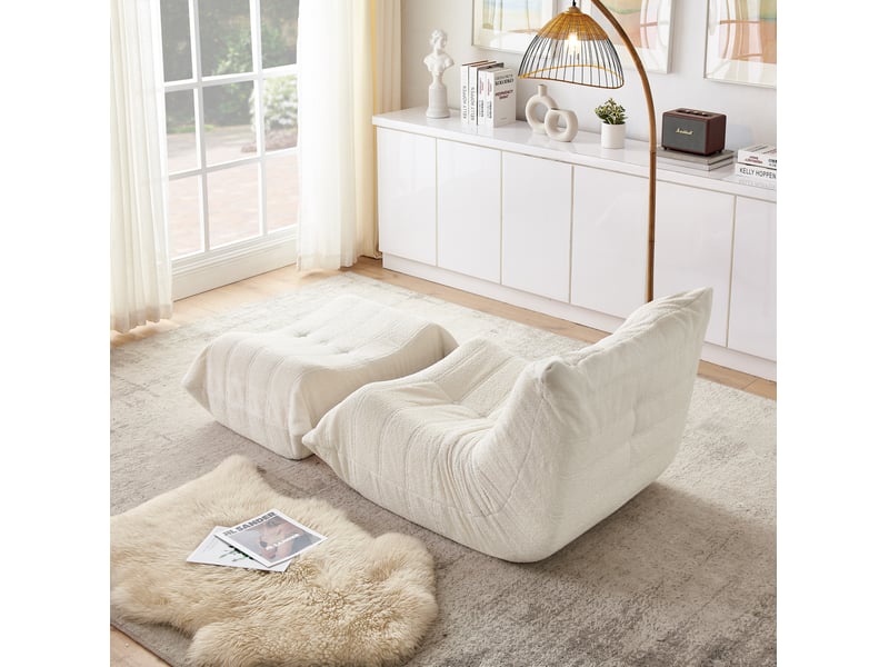 Fauteuil de sol 90x100x70 cm avec repose-pieds, dossier enveloppant, mousse haute résilience, tissu teddy beige - Conforama D