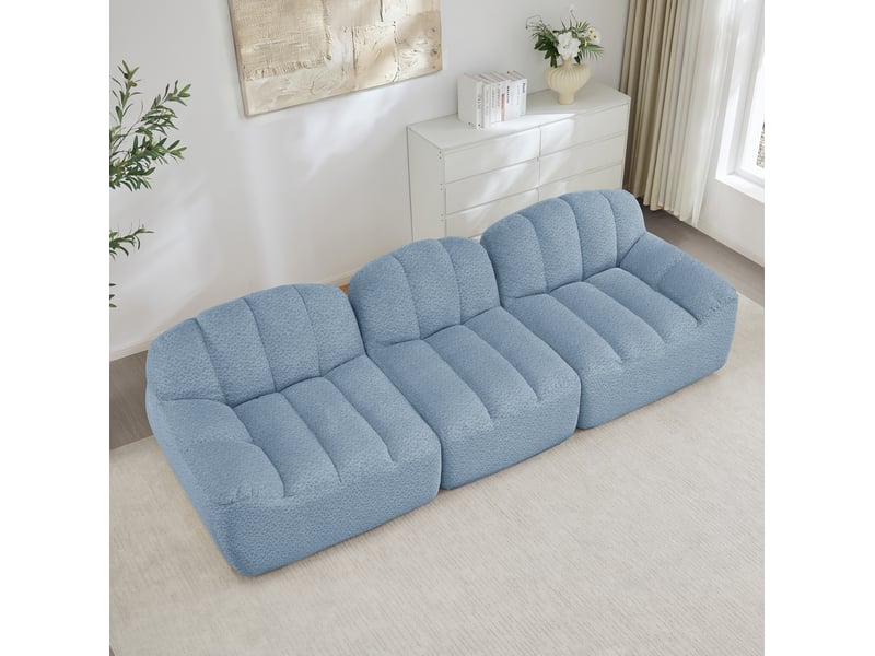Canapé modulable 3 places bleu en tissu bouclette, sans cadre, à assise profonde, confortable pour le salon familial. - Conforama B