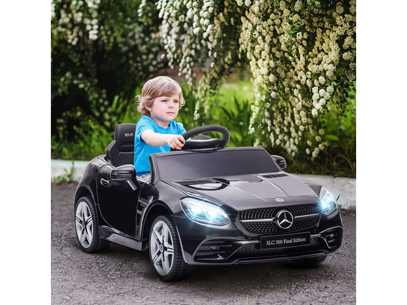  Voiture électrique pour enfants, avec phares led, ceinture de sécurité, klaxon, musique, 3-5 kmh, noire, 107 x 62,5 x 44 cm  - Conforama C