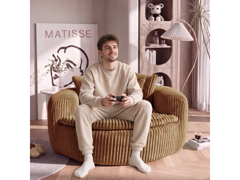  Canapé pouf lounge 1 place, assise profonde rembourrée, accoudoirs enveloppants, 5 coussins, velours côtelé camel, 145 x 133 x 59 cm  - Conforama B
