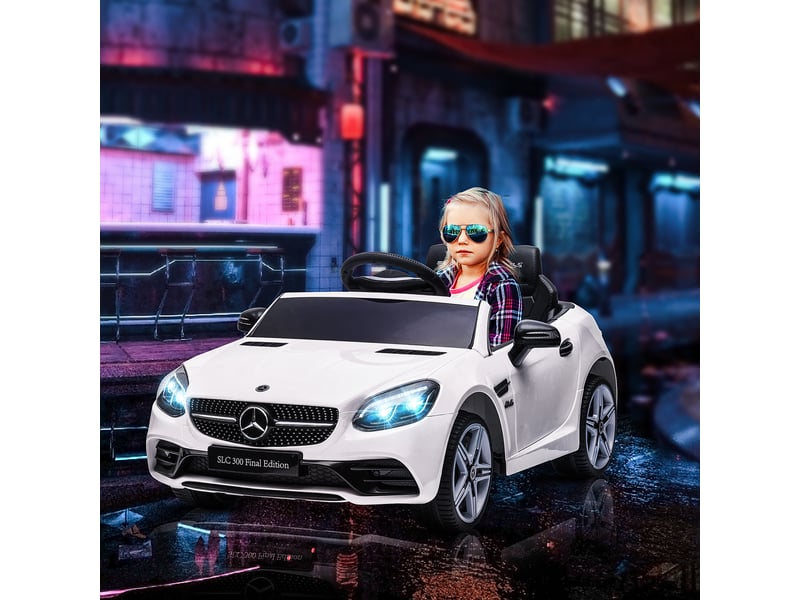  Voiture électrique pour enfants, avec phares led, ceinture de sécurité, klaxon, musique, vitesse de 3 à 5 kmh, blanche, 107 x 62,5 x 44 cm  - Conforama D