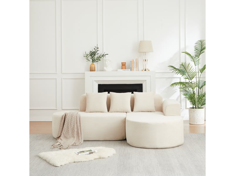 Canapé d'angle modulable à méridienne incurvée, accoudoirs arrondis et trois coussins en velours côtelé beige, 220 cm - Conforama C