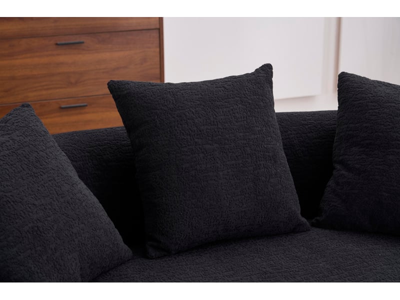 Canapé compressé 2 places incurvé en chenille noire, 3 coussins décoratifs - Conforama E