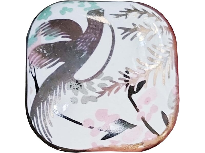 Poignée en porcelaine dorée avec un oiseau