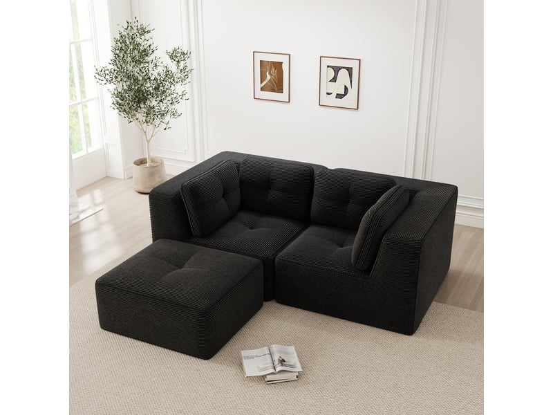  Canapé d'angle modulaire convertible avec assise profonde et accoudoirs larges, en velours côtelé noir  - Conforama D