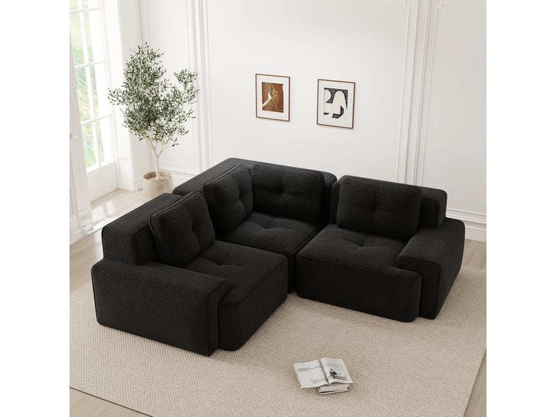  Canapé d'angle modulaire sans armature avec assise profonde et dossier enveloppant en velours côtelé noir  - Conforama D