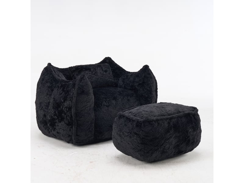  Pouf géant noir en fausse fourrure avec coussin et repose-pieds  - Conforama D