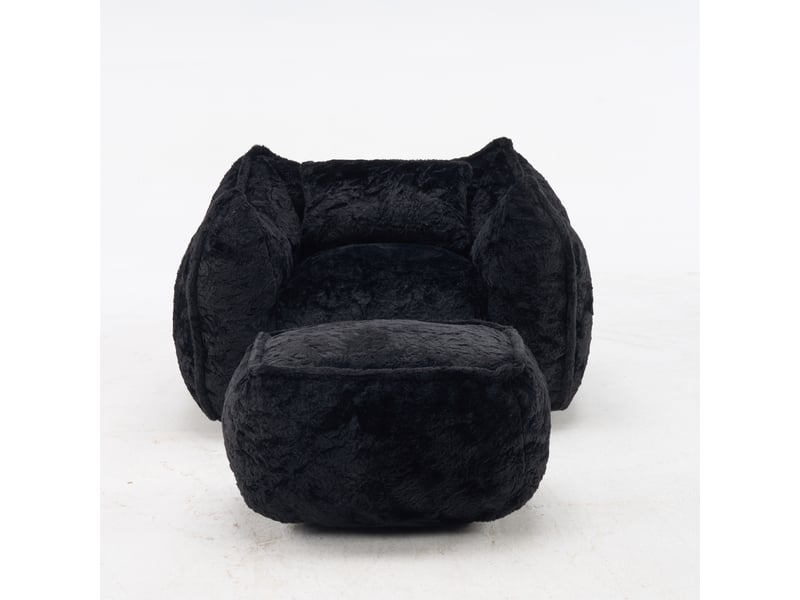 Pouf géant noir en fausse fourrure avec coussin et repose-pieds - Conforama A