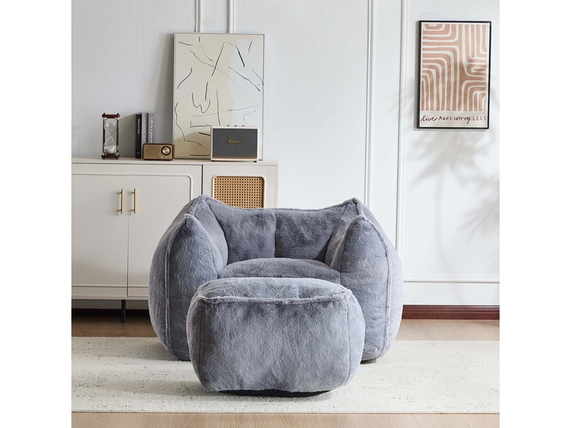 Fauteuil avec pouf assorti, assise en mousse et forme arrondie pour salon, en fausse fourrure grise - Conforama C