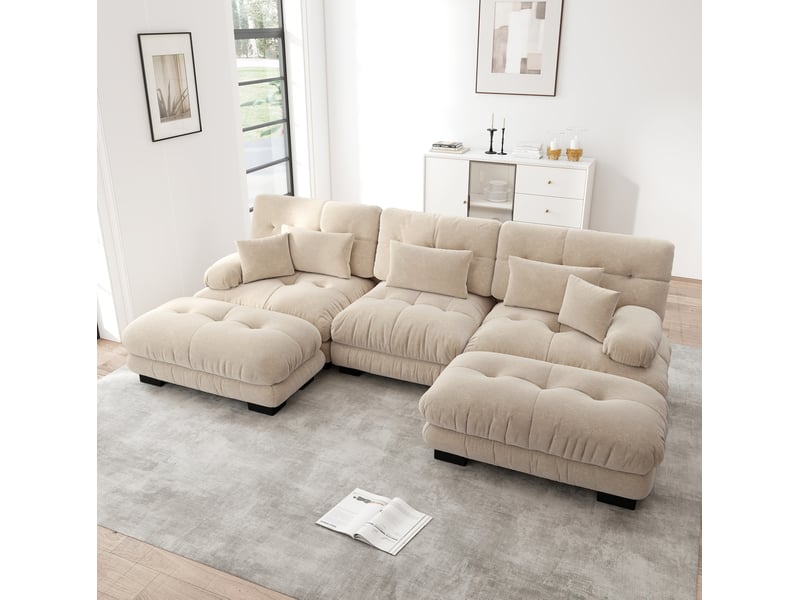 Canapé d’angle modulable 3 places en tissu beige clair, avec ottomans mobiles, confort profond pour salon familial - Conforama B