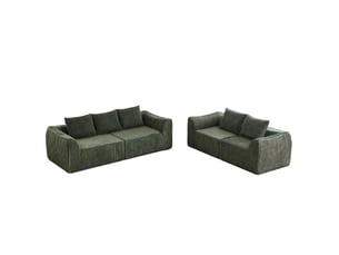 Canapé droit épuré en velours côtelé, silhouette fine, dossier en pente douce, 5 coussins, vert