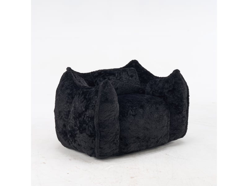 Pouf géant noir en fausse fourrure avec coussin, assise confortable pour salon - Conforama D