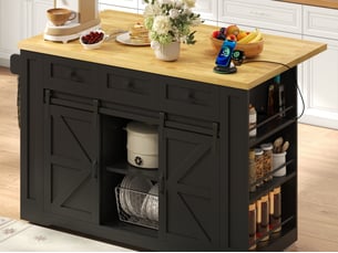 Îlot de cuisine mobile 130 x 50-80 x 87 cm, plateau rabattable, prises, 3 tiroirs et portes coulissantes, noir